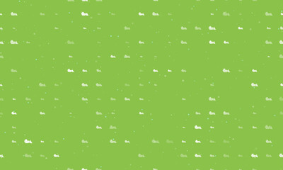 Seamless background pattern of evenly spaced white bulldozer symbols of different sizes and opacity. Vector illustration on light green background with stars