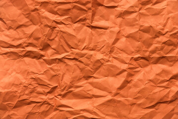 Orange crumpled paper for background.
