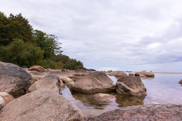 Fototapeta na wymiar Sea view with blue sky, various rocks and green trees