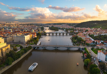 Fototapeta na wymiar Bridges crossing a river in Europe at sunset