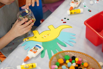 Dinosaurs kids crafts at summer school. Summer camp crafts.