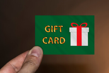 Hand holding a gift card