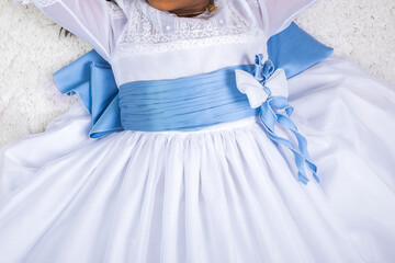 dress and outfit for holy Communion girl with medal of "Our Lady of Divine" and blue flower belt