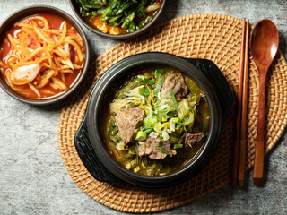 Galbi soup and various side dishes in a hot pot