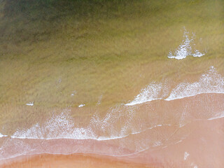Fototapeta premium Surf line on the sandy beach of the Barents Sea. Teriberka