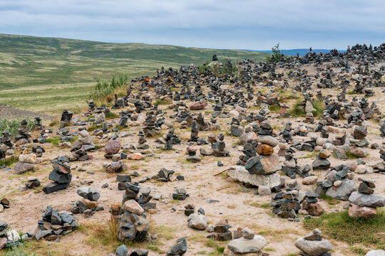 Landscape with neatly arranged stones near Teriberka. The open space of the northern lands in clear sunny weather. The Kola Peninsula