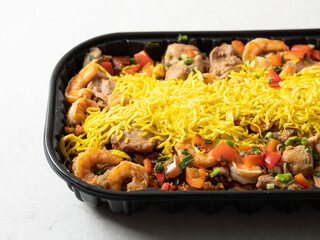 Southeast Asian-style fried rice with stir-fried meat and various vegetables