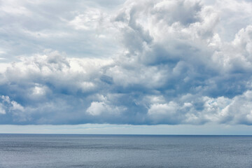 Dark clouds over a calm sea