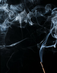 Smoke on dark background from smoldering burning cone incense. Indian scented burning wooden stick for aromatherapy, meditation or room fragrance. Incense Smoke. Overlay layer