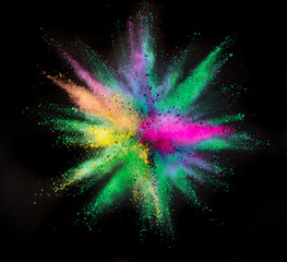 Freeze motion shot of color powder explosion isolated on black background