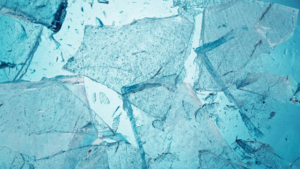 Abstract ice texture. A network of cracks on a piece of blue ice