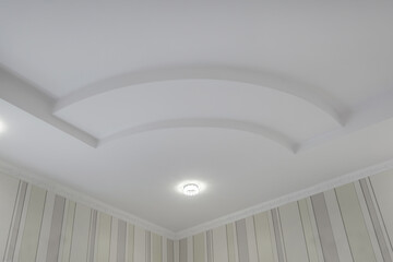 Detail of corner ceiling with intricate crown molding. Suspended ceiling and drywall construction...