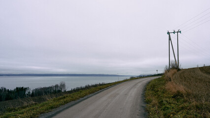 Fototapeta premium A gravel road by Lake Mjøsa.