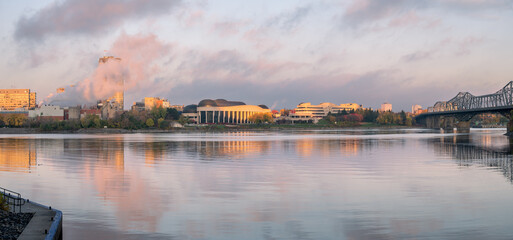 View of the across the Ottawa River towards the Canadian Museum of History in Gatineau at sunrise.