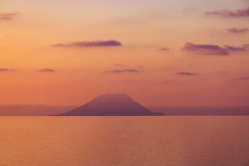 Naklejka na ściany i meble Stromboli Island with an Active Volcano in Tyrrhenian Sea. Italy. Sunny Morning Sunrise Sky. Nature Background