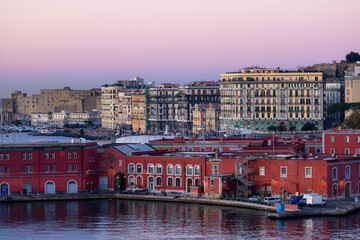 Port and Buildings in Historic Downtown City on Mediterranean Coast of Naples, Italy. Sunrise Sky.
