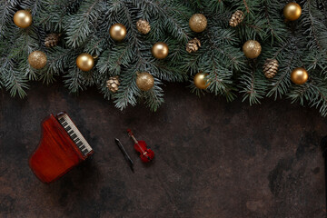 Miniature copies of the piano and violin with golden colored Christmas decor. Christmas, New Year's...