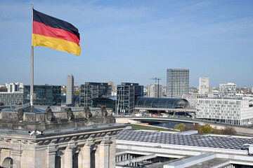 Berlin cityscape with flag of Germany. Modern buildings of Berlin