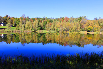 Fall landscape reflection Bromont Eastern Township Quebec province Canada