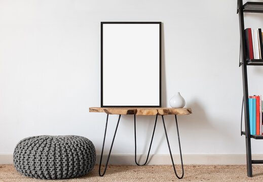 Blank Picture Frame Mockup On White Wall. White Living Room Design. View Of Modern Scandinavian Style Interior With Artwork Mock Up On Wall. Home Staging And Minimalism Concept