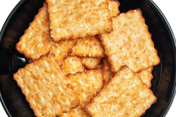 Crunchies biscuits close up on a black dish