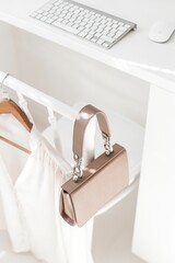 Vertical closeup of a stylish leather purse on a display