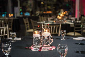 Table set up with a glass cup and candles