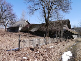 Outdoor view of old farmhouses and fence in the countryside
