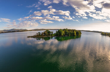 Aerial View. A tiny quiet island over the Lake at sunset