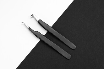 Tools for eyelashes, tweezers and brush. Black and white.