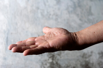 Older man's hands, anatomical detail, skin texture, expression and manual language, working man's hand.