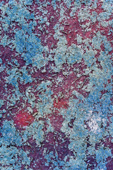 Texture of a burgundy fabric surface strewn with blue crystals, dirty texture, spotted uneven pattern, blue, turquoise and pink colors