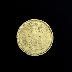 20 euro cent coin, close up view on a black background