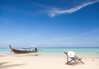beautiful tropical beach in Thailand with longtail boats