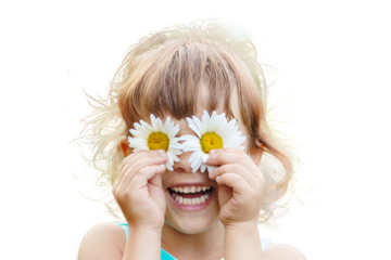 the girl is holding chamomile flowers in her hands. Selective focus.