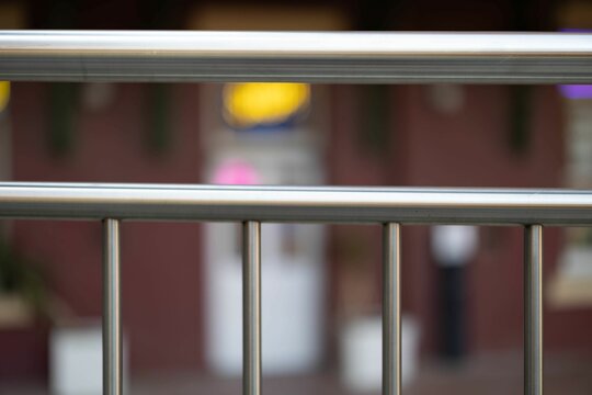 A Metal Balcony Railing Next To A Street