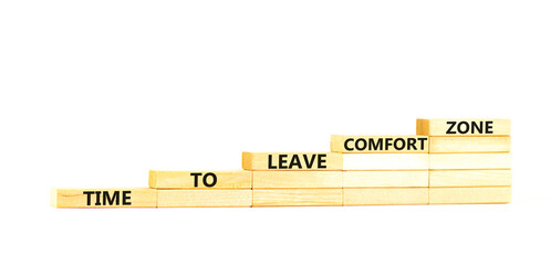 Leave comfort zone symbol. Concept words Time to leave comfort zone on wooden blocks. Beautiful white table white background. Business time to leave comfort zone concept. Copy space.