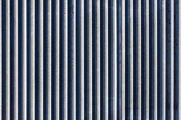 White and grey corrugated metal fence.