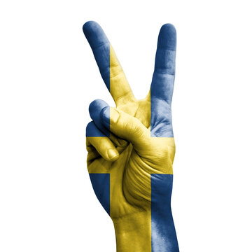 Hand making the V victory sign with flag of sweden