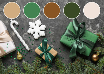 Composition with fir branches, Christmas gifts and decorations on grey background. Different color...