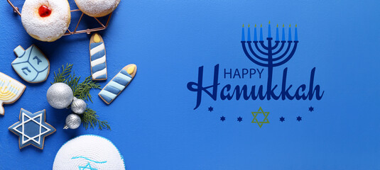 Fototapeta Greeting card with symbols of Hanukkah and Christmas decor on blue background obraz