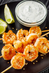 delicious grilled shrimp appetizer on a black wooden rustic background