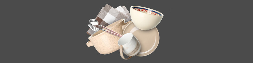 Flying clean tableware with napkin on grey background