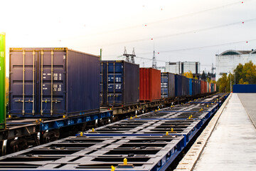 Freight train. Cargo containers transportation by railway. Impoert export logistics concept. Shipping by train. Cargo train platform.