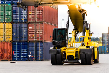 Container handlers. Forklift truck in shipping yard. Industrial container logistic yard. Logistics import export concept.