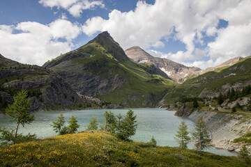 Naklejka na ściany i meble The beautiful view of Margaritzenstausee - Stausee Margaritze. High Tauern National Park, Carinthia, Austria. Freiwandkopf in the background. Close by Grossglockner and Kaiser Franz Josefs Hohe
