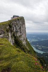 Fototapeta na wymiar The beautiful view of Schafberg, 1783 m, during cloudy day, mountain in the Austrian state of Salzburg, Austria, Europe. Portrait HD, 4k wallpaper. Mondsee lake in the background.