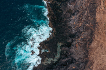 Sea waves breaking in the coast