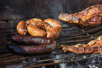 Barbecue, grilled sausages and cow meat , traditional argentine cuisine