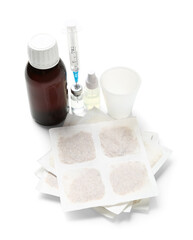 Mustard plasters with medicines on white background